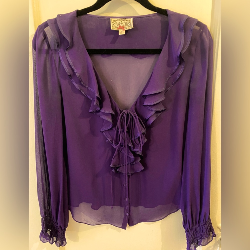 Beautiful light float silk. Perfect with jeans, a skirt or anything in between.